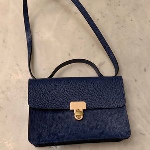 Used Orla Kiely small cross body attaché purse.